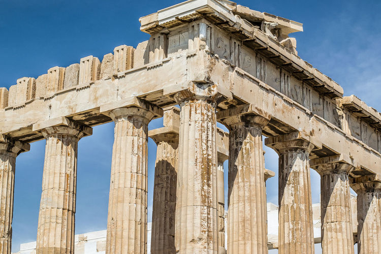 Summer low angle view of the parthenon historical site at the acropolis in athens, greece. 
