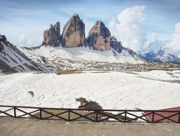 Breathtaking view from mountain hut terrace to symbol of italian dolomites - tre cime. high rocks