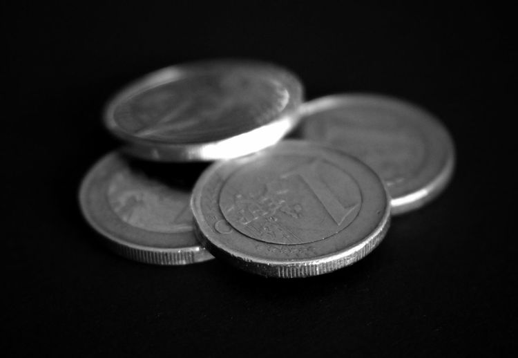 Close-up of european union coins on black background