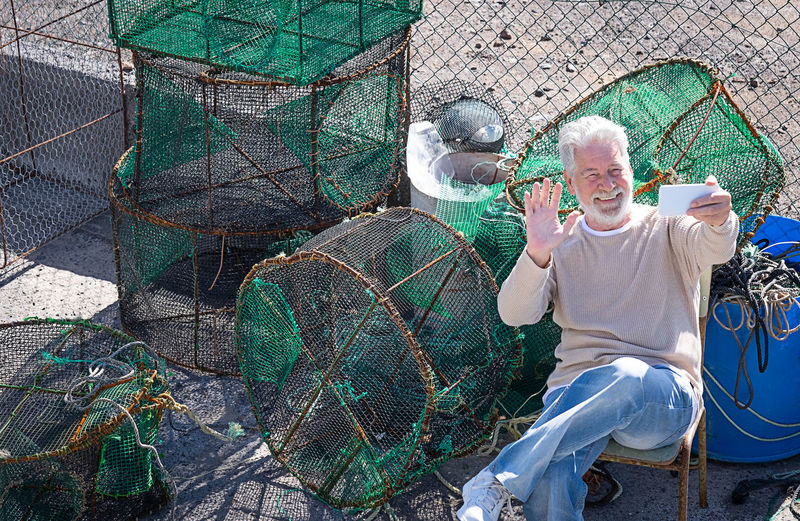 Man working on fishing net