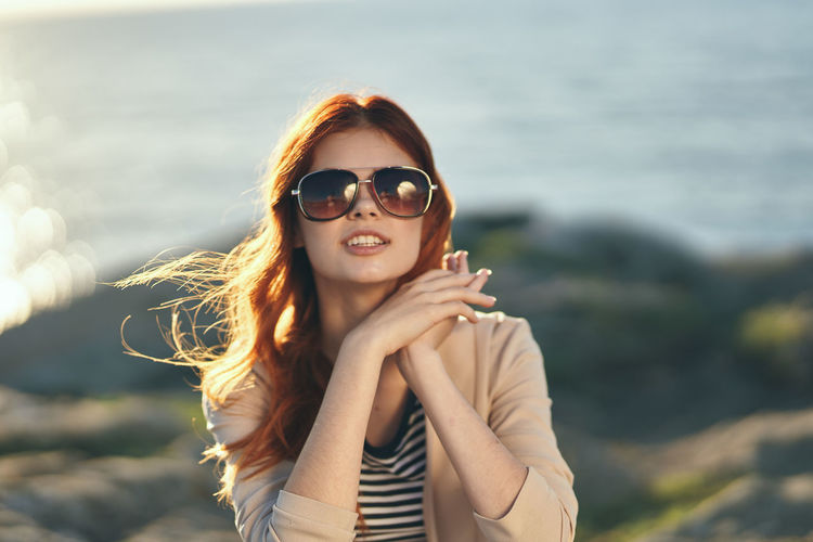 Portrait of young woman wearing sunglasses