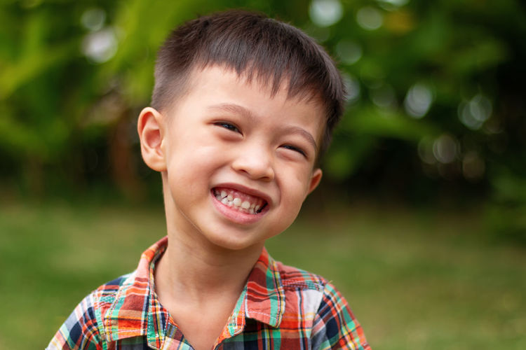 Close-up portrait of smiling cute boy