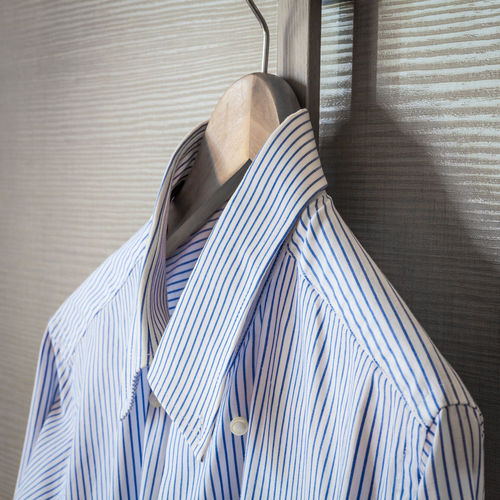 Close-up of striped shirt hanging on coathanger