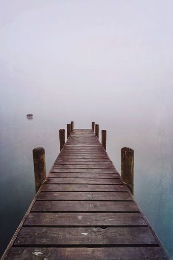 Pier over sea against sky