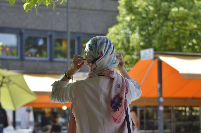 Rear view of woman standing outdoors