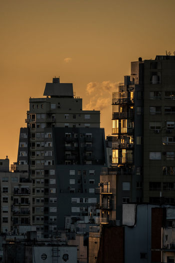 Buildings against sky during sunset
