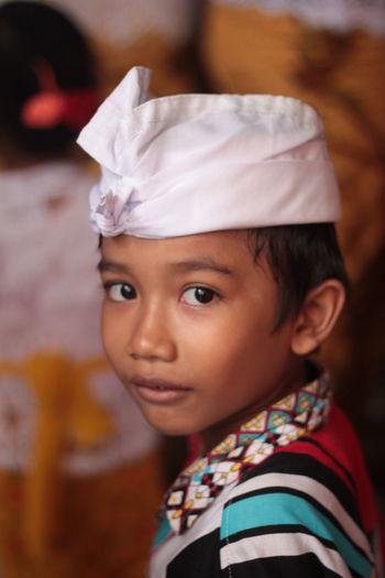 Close-up portrait of boy wearing hat