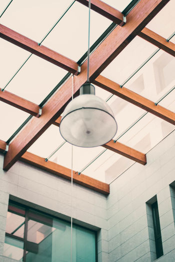 Low angle view of pendant light hanging from ceiling