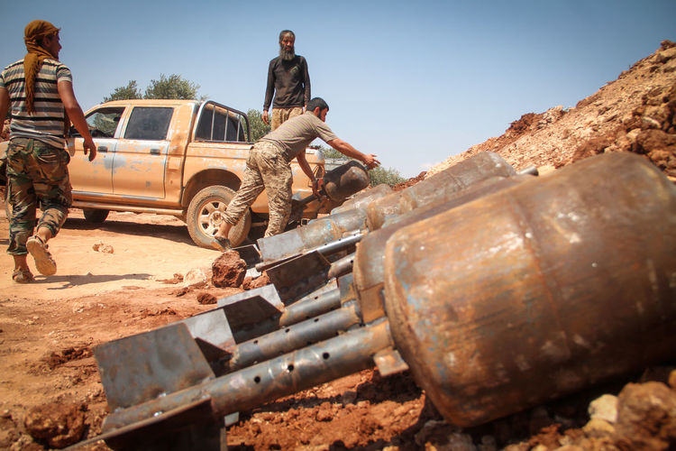 Close up of the soldier fill his weapon ammunition