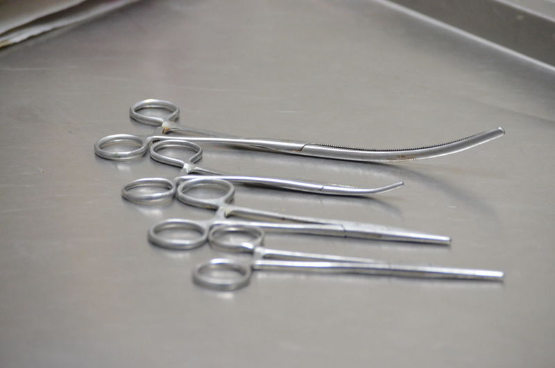 High angle view of surgical scissors on table