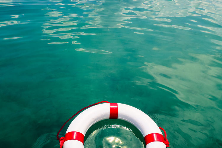 High angle view of lifeguard ring floating at lake