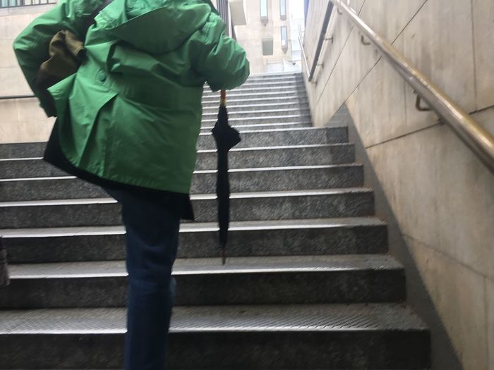 Low section of person walking on stairs