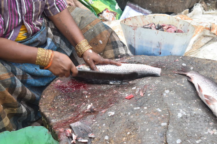 Man working at fish market