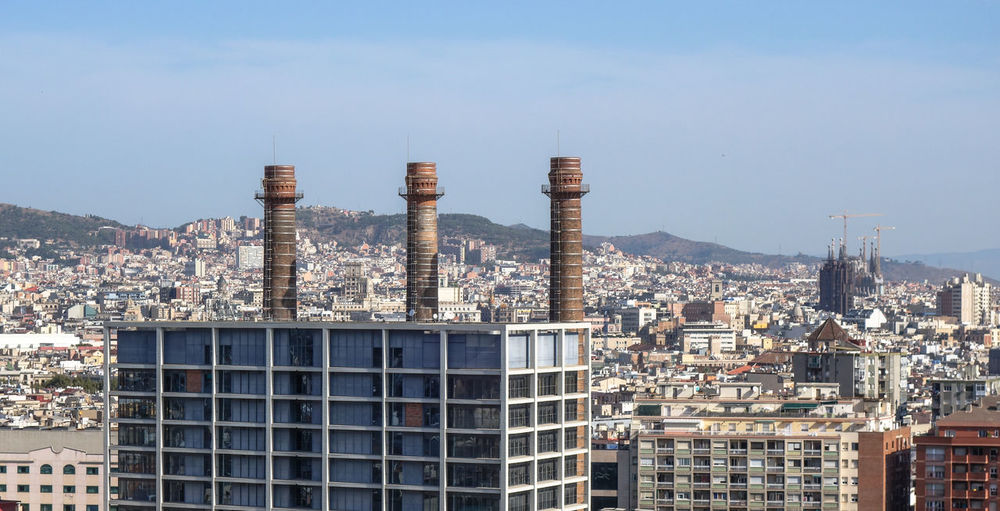 Buildings in city against sky