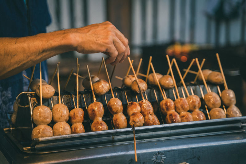 Midsection of man preparing food