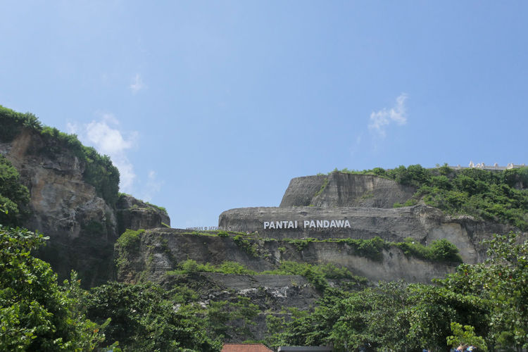 Low angle view of pandawa beach nameplate