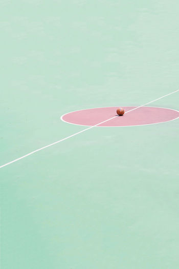 High angle view of basketball on court during sunny day