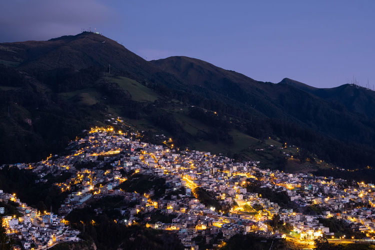 High angle view of illuminated buildings in city at night