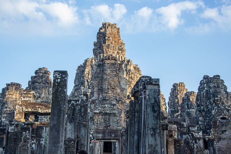 Low angle view of old building against sky at angkor wat temple, cambodia