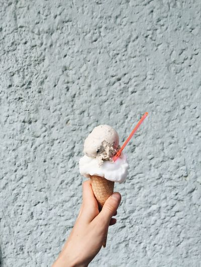 Cropped hand holding ice cream