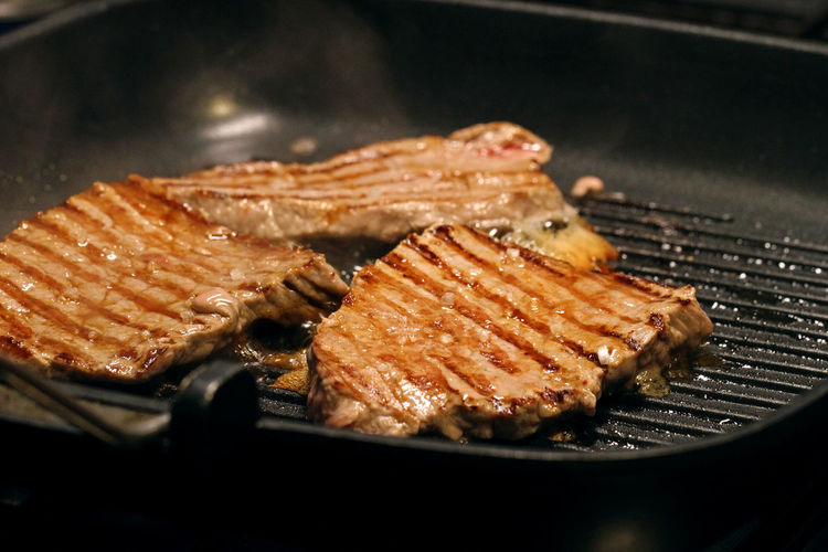 Close-up of grilled beef steak on pan