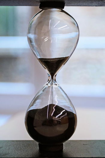 Close-up of hourglass on table