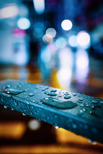 Close-up of raindrops on table