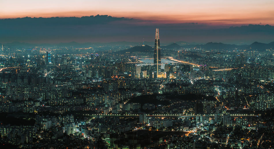Aerial view of illuminated cityscape at night