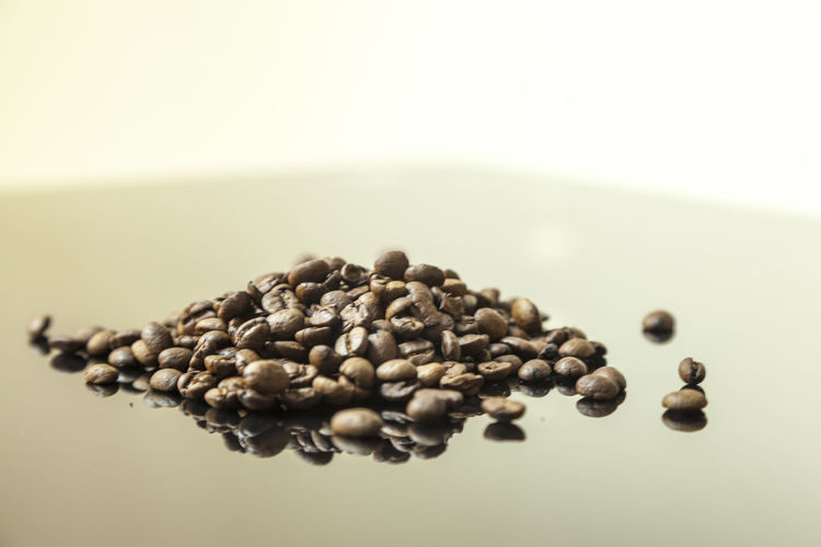 Close-up of coffee beans against white background