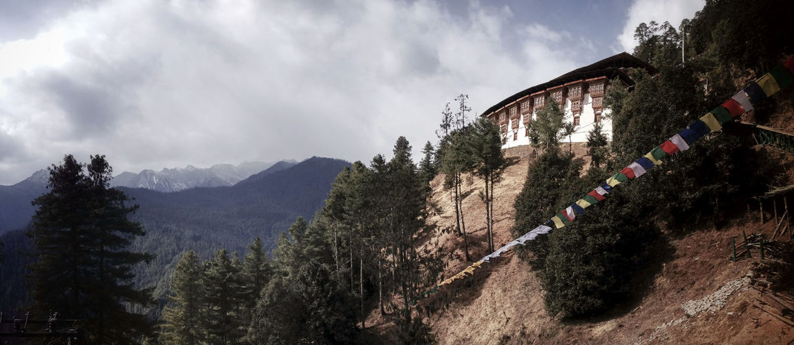 Tango monastery on mountain against cloudy sky