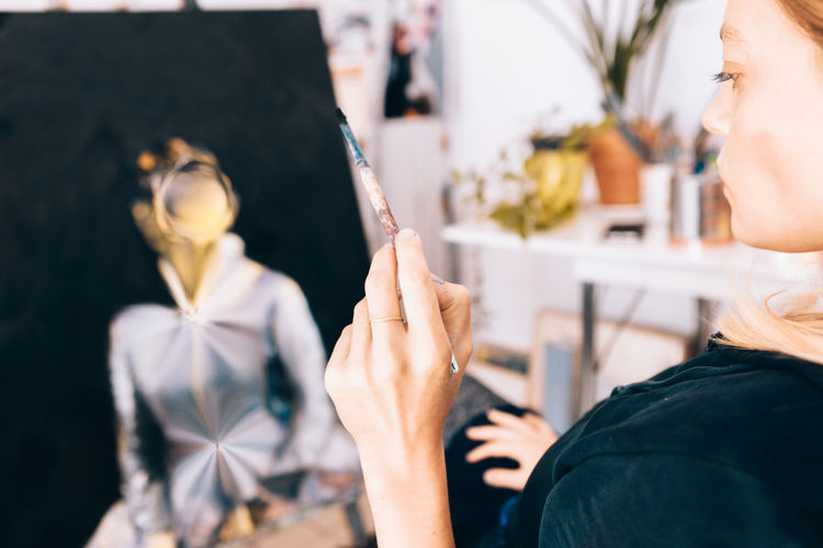 Woman painting at studio
