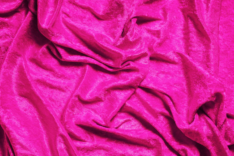 Full frame shot of pink petals on bed