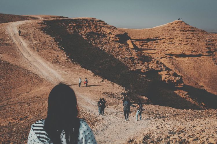 People mountain against sky