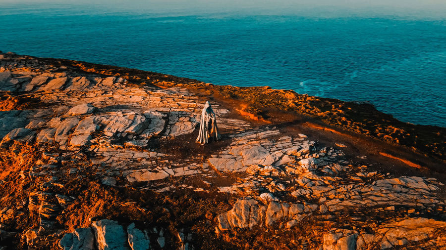 Aerial view around the monument to king arthur in britain monument close up on sea background.