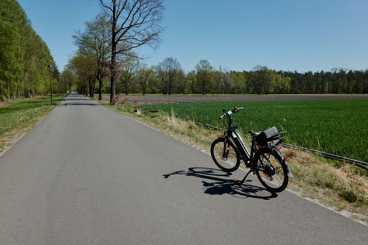 Black electric bicycle on a bicycle path as concept photo for a bicycle tour