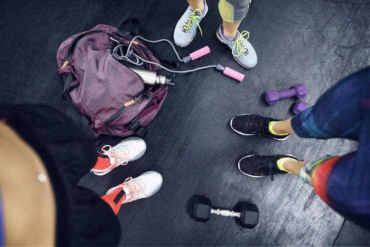 Overhead view of female athletes standing at gym