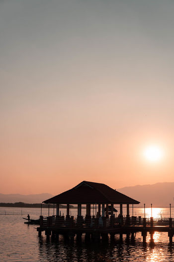 Scenic view of sea against orange sky