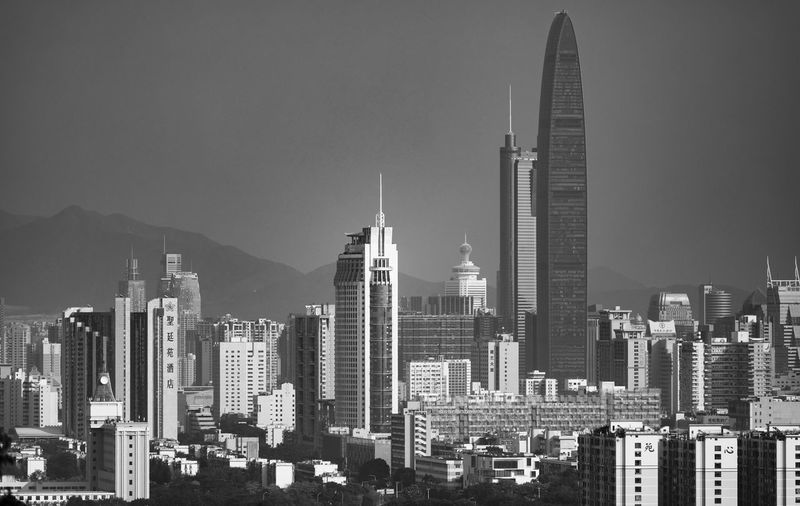 Modern buildings in city against sky