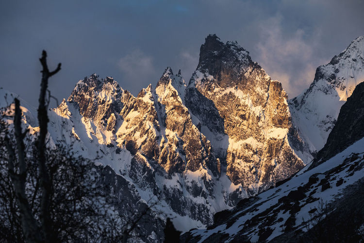 Steep snow covered alpine mountain landscape at sunrise nepal himalaya