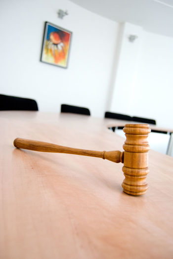 Close-up of gavel on desk