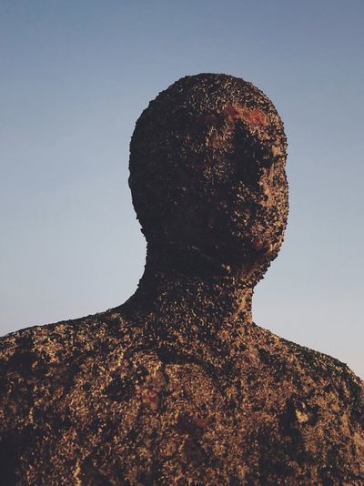 Close-up of an anthony gormley statue in margate