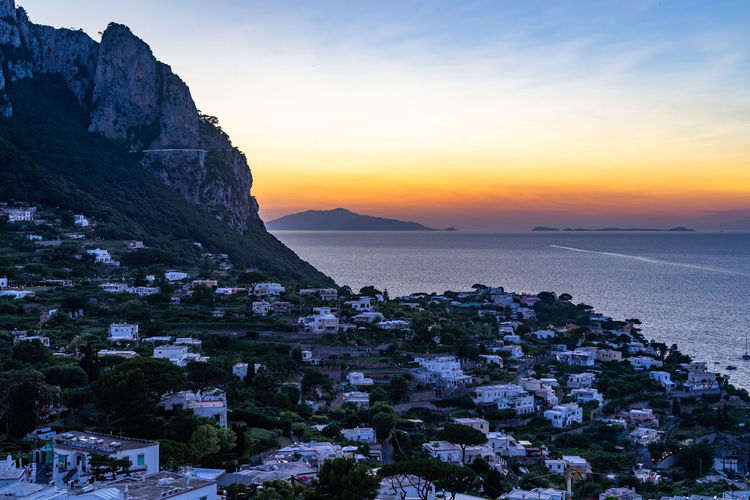 A beautiful sunset in capri with ischia island in the background, campania, italy