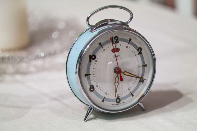 Close-up of clock on wall