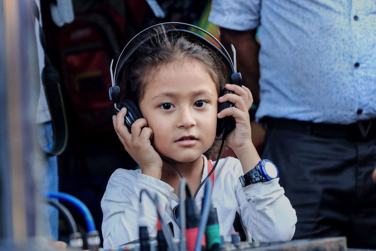 Portrait of cute girl wearing headphones
