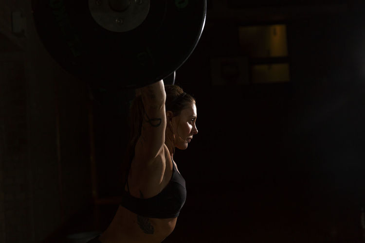 Woman preparing for weightlifting