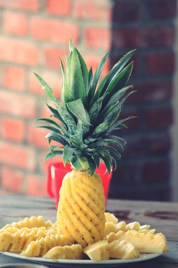 Close-up of pineapple in plate on table