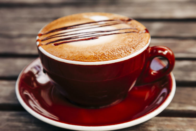 Close-up of cappuccino on table