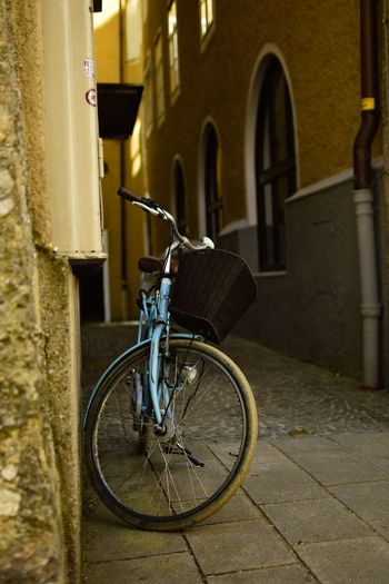 Bicycle leaning against building