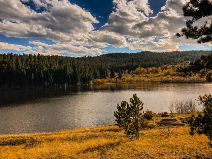 Scenic view of lake and mountains against sky