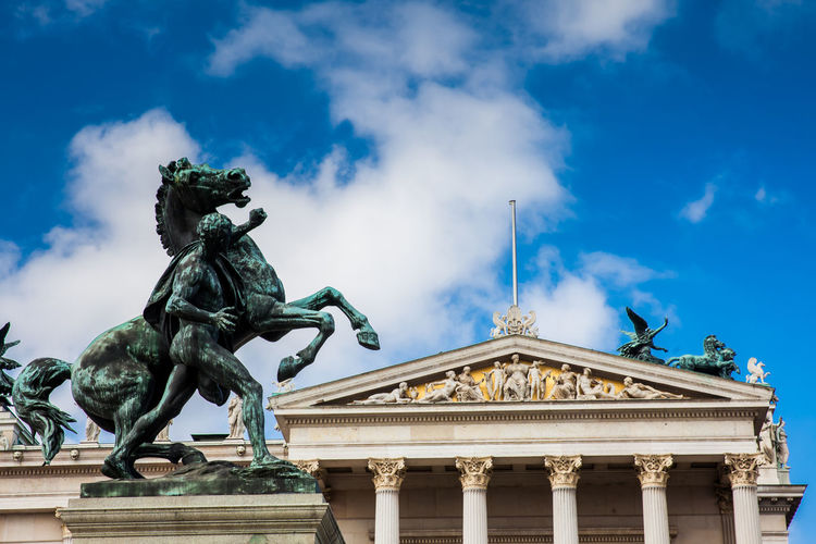 The historical austrian parliament building completed in 1883, located on the ringstrabe boulevard